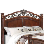 Letto in legno con testiera intagliata in ciliegio scuro