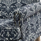 Poltrona in legno imbottita in stile transizionale con motivo floreale, braccioli a pannello e schienale a gobba di cammello