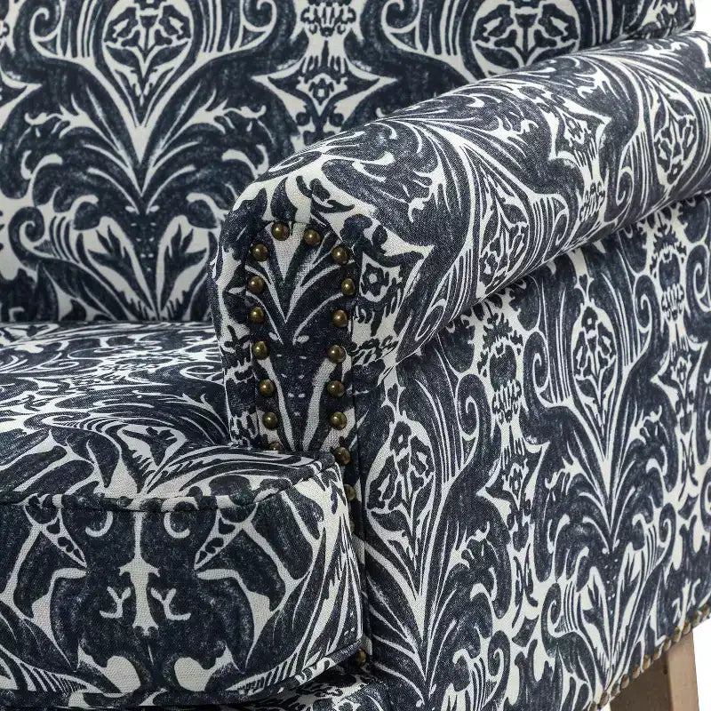 Poltrona in legno imbottita in stile transizionale con motivo floreale, braccioli a pannello e schienale a gobba di cammello