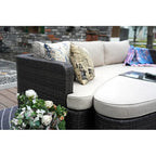 Set da esterno 9 pezzi con divano letto in vimini e tavolo braciere in cemento