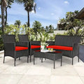 Set divano da esterno in rattan imbottito 4 pezzi con tavolino da caffè in vetro temperato - 24 x 23,5 x 33 (L x P x A)